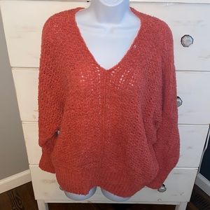 NWOT beautiful coral colored sweater.